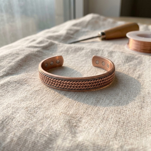 Cuivre Garance twisted braid copper cuff bracelet on linen