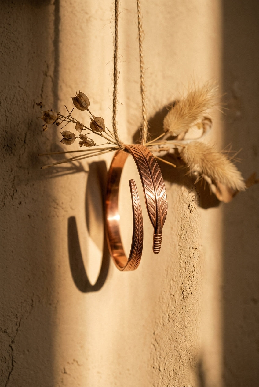 Cuivre Sidonie copper bracelet hanging from twine in golden hour light